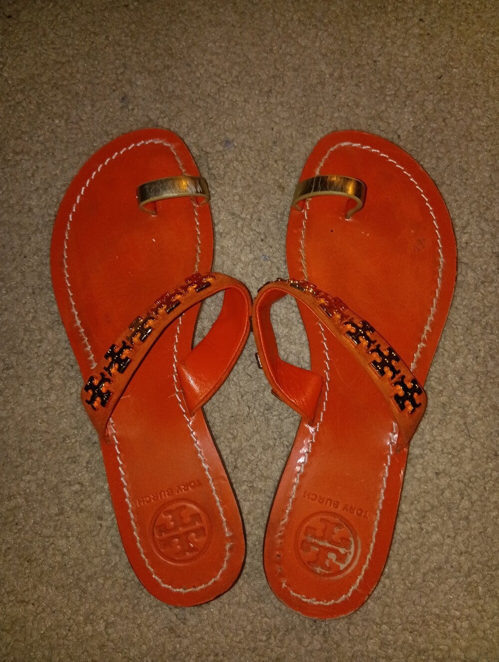 Tory Burch Orange Leather Toe-Loop Sandals with Gold Accent.